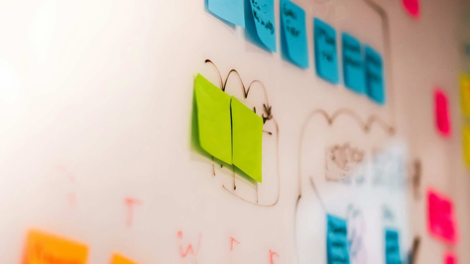 Colourful sticky notes on a wall